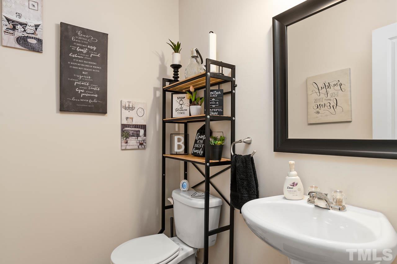 3540 Eastern Branch Road Raleigh, NC 27610 - Photo 8 of 35 a bathroom with a toilet and a sink