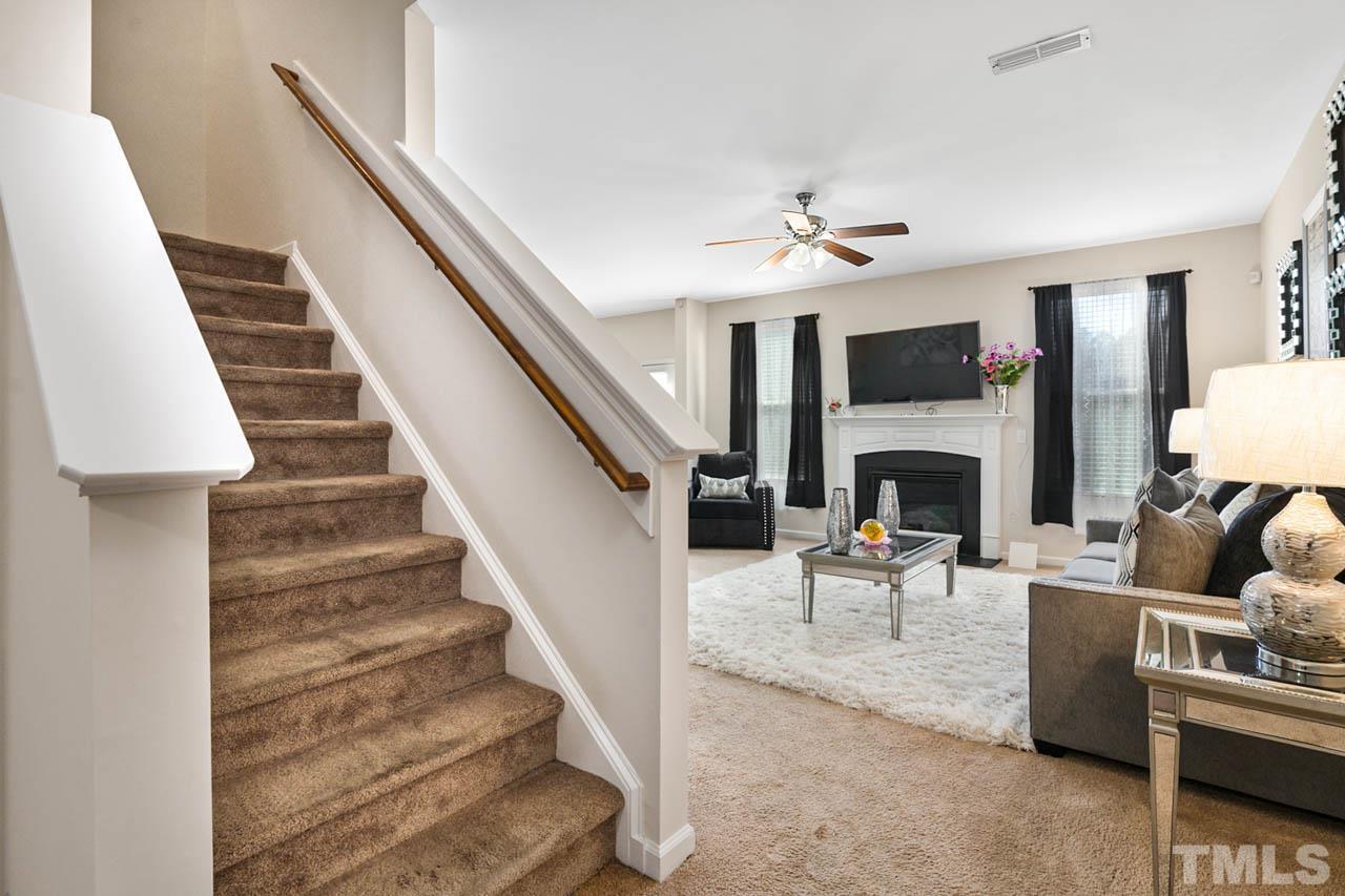 3540 Eastern Branch Road Raleigh, NC 27610 - Photo 9 of 35 a living room with furniture and a fireplace