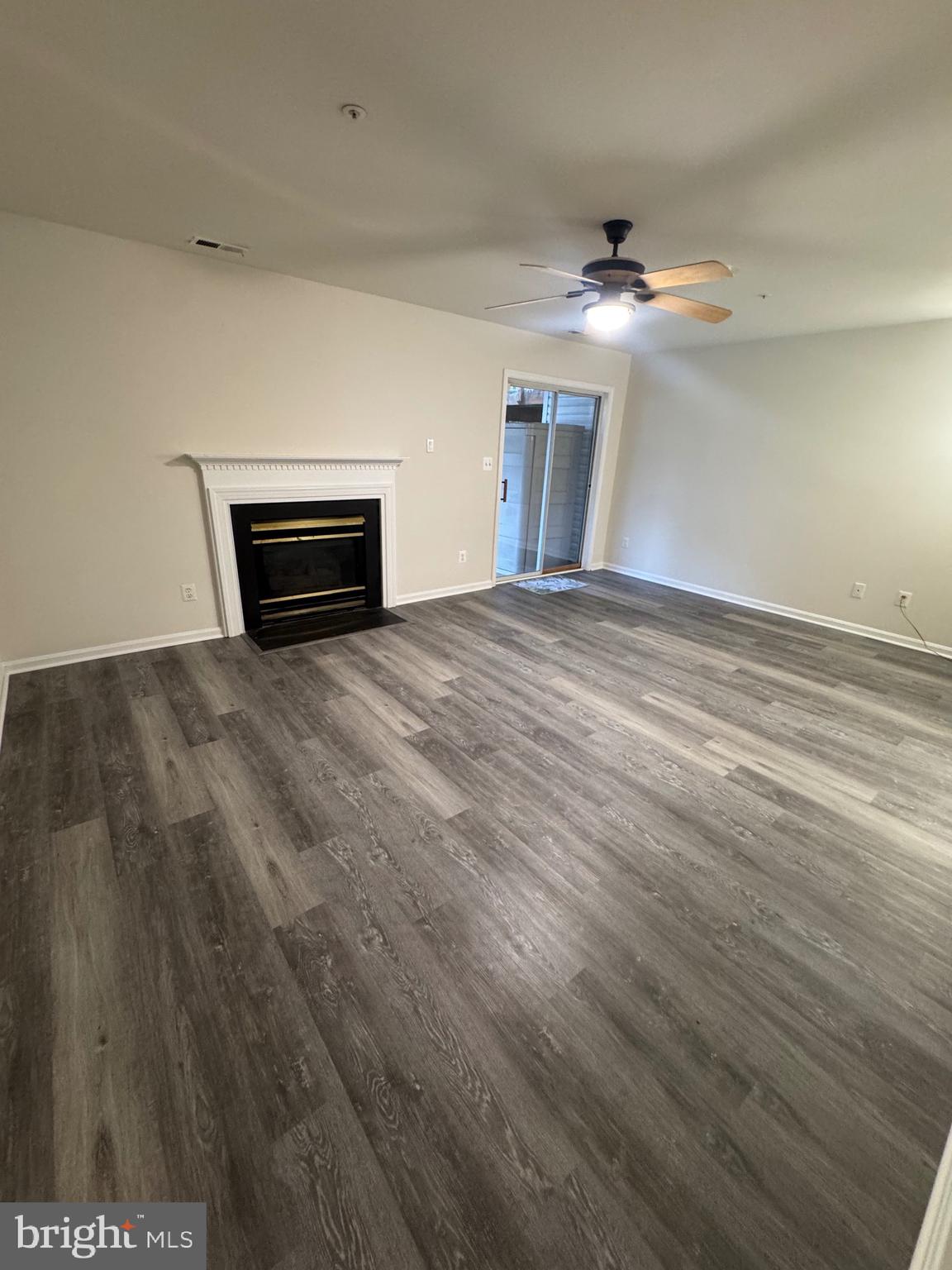 7705 Periwinkle Way, Unit 71 Severn, MD 21144 - Photo 8 of 28 a view of empty room with wooden floor