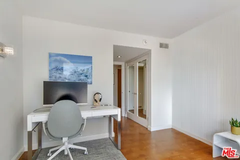 a bathroom with a mirror sink and vanity