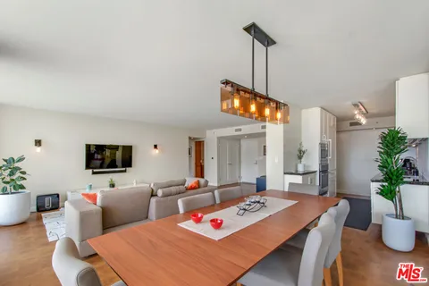 a living room with furniture and flat screen tv