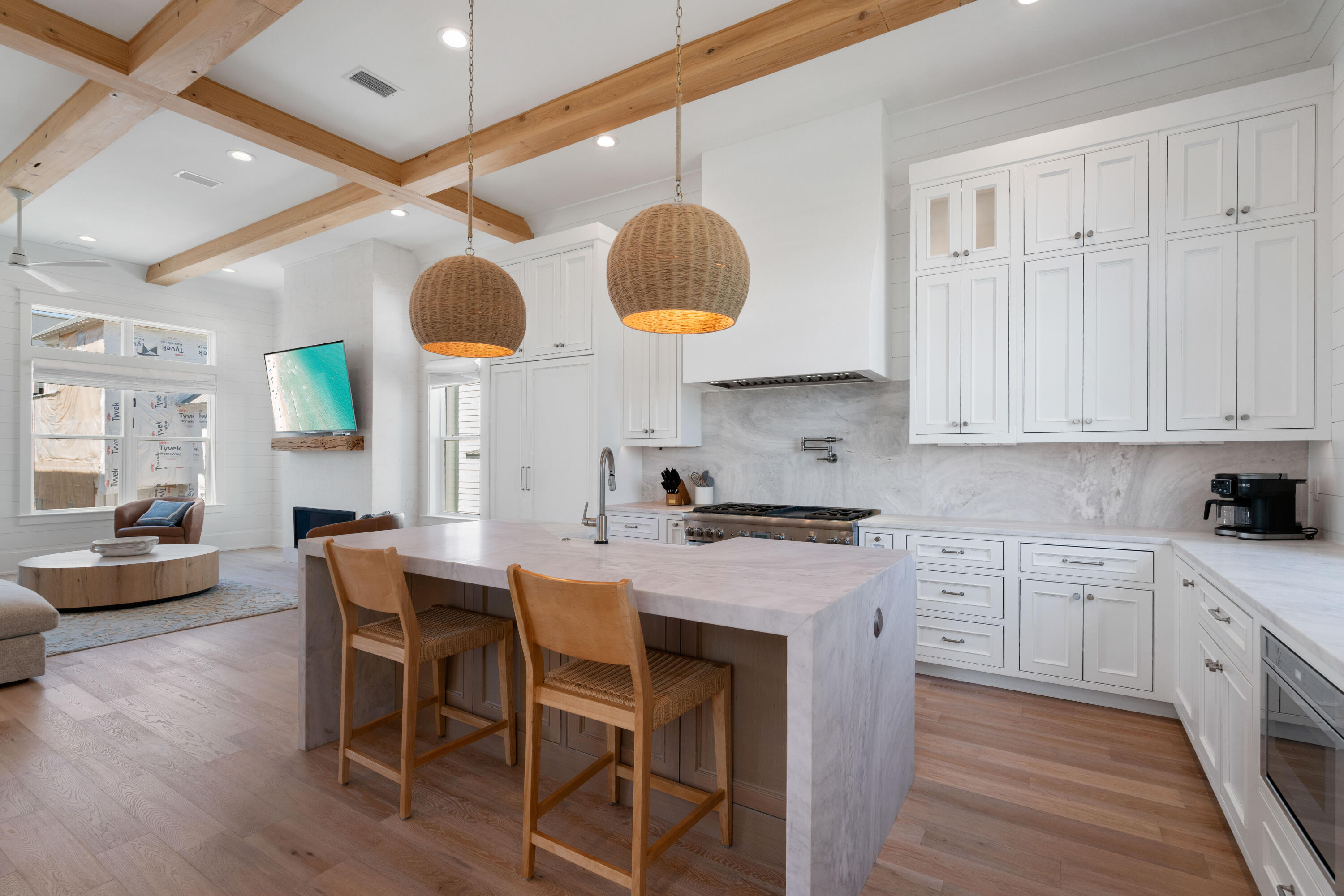 16 Bluewater View Ave Inlet Beach Inlet Beach, FL 32461 - Photo 25 of 59 a kitchen with stainless steel appliances granite countertop a stove a sink a dining table and chairs with wooden floor