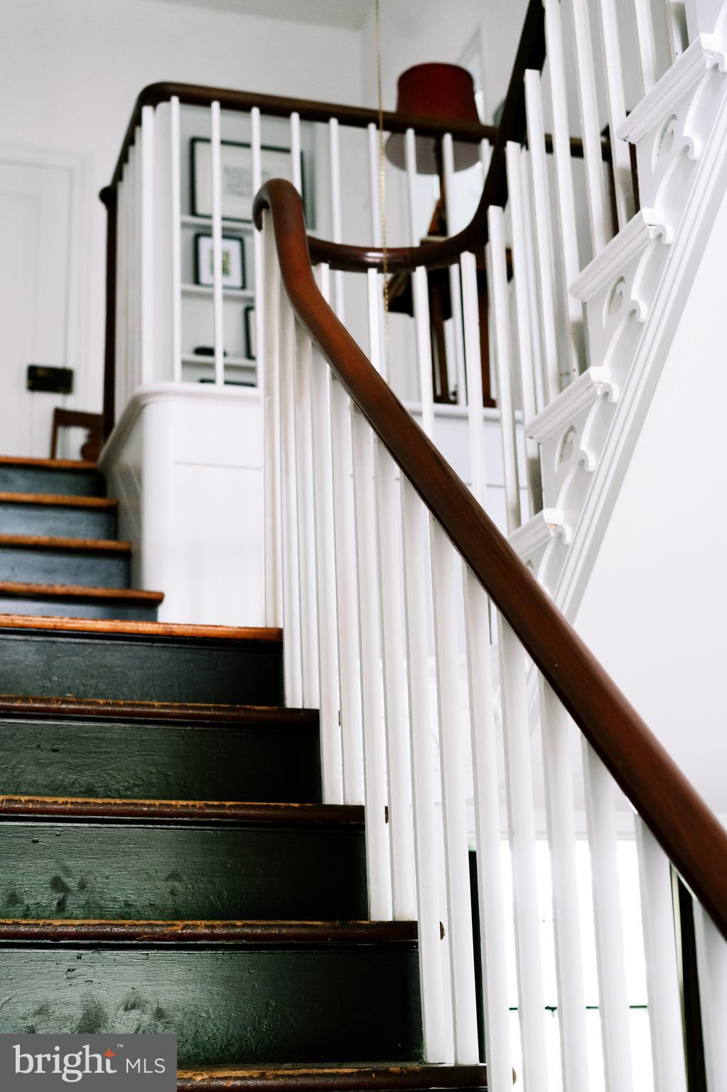 1498 Mckinstrys Mill Road Union Bridge, MD 21791 - Photo 23 of 54 a view of staircase with wooden floor and white walls