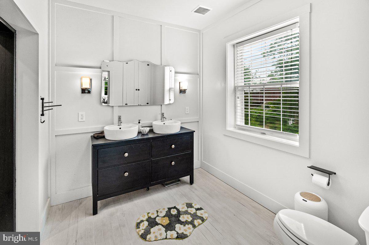 1498 Mckinstrys Mill Road Union Bridge, MD 21791 - Photo 27 of 54 a bathroom with a sink and a mirror