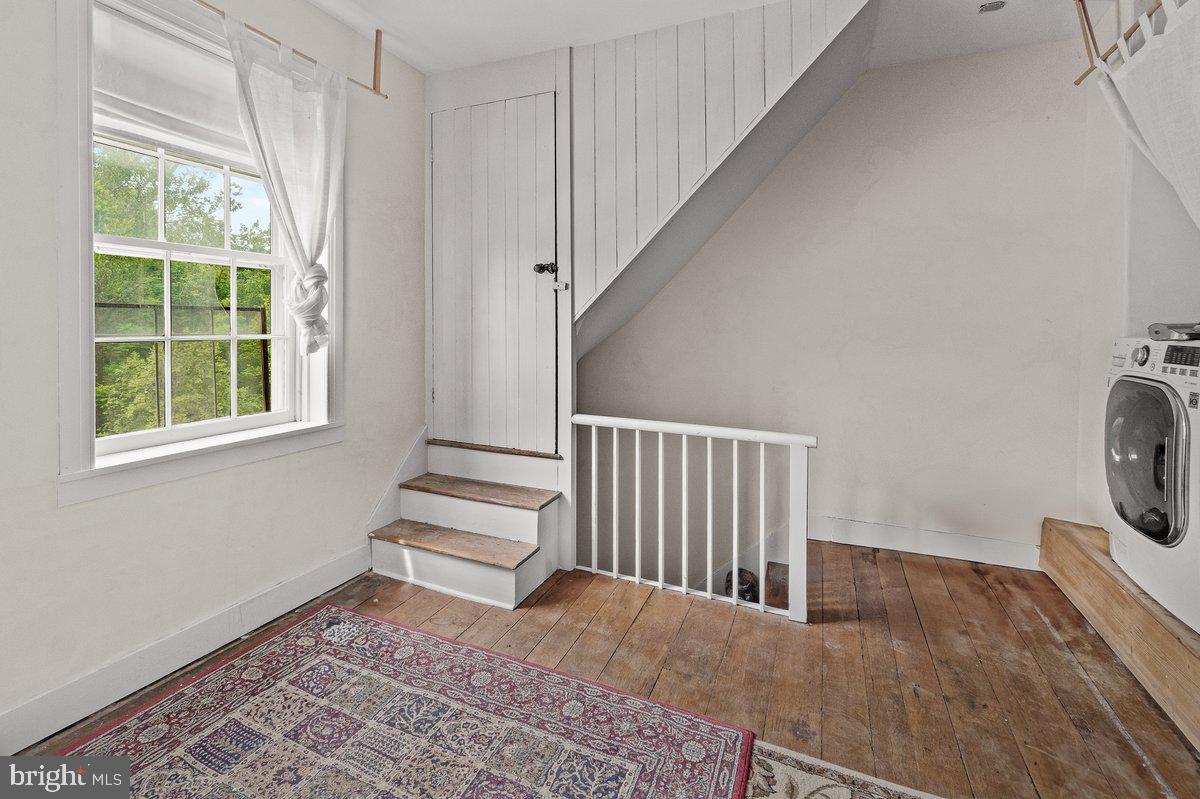 1498 Mckinstrys Mill Road Union Bridge, MD 21791 - Photo 29 of 54 a view of a livingroom with wooden floor and a window