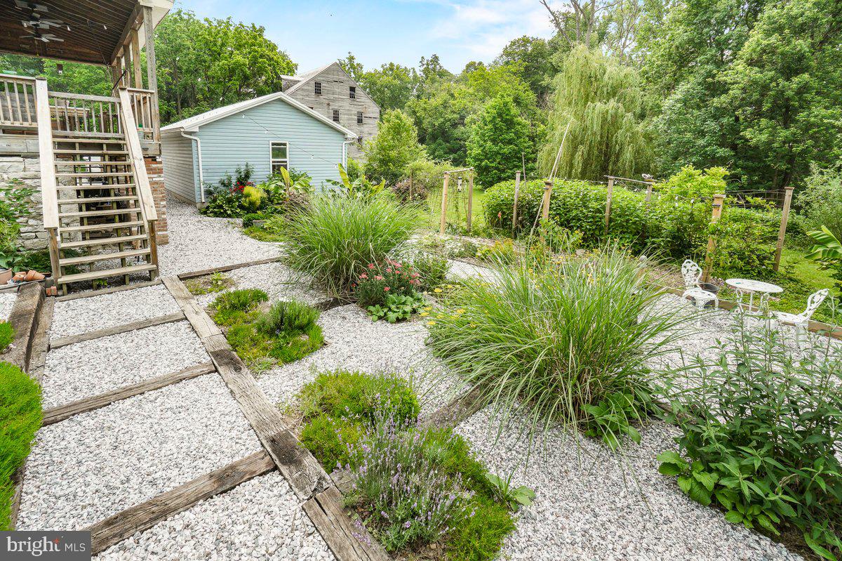 1498 Mckinstrys Mill Road Union Bridge, MD 21791 - Photo 40 of 54 a view of a garden with a pathway