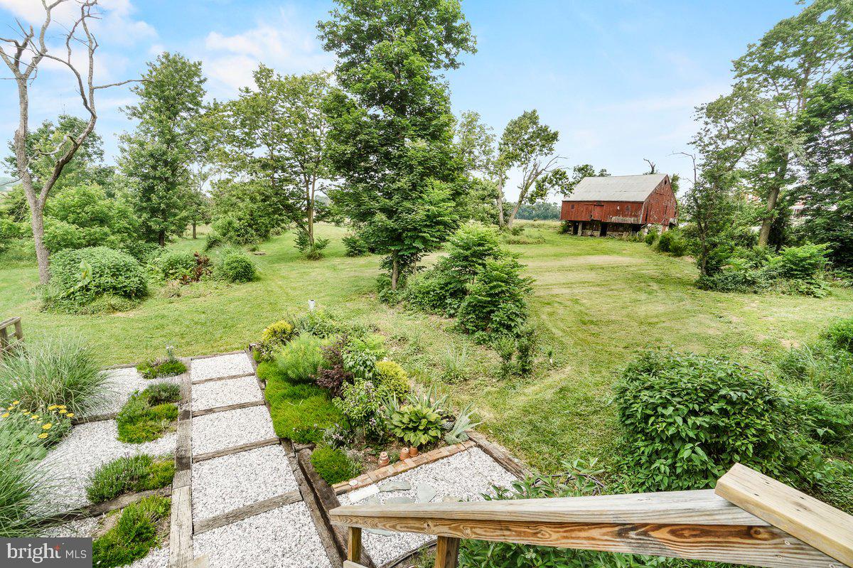 1498 Mckinstrys Mill Road Union Bridge, MD 21791 - Photo 41 of 54 a view of a garden with an outdoor seating