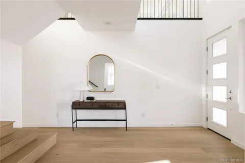 a view of a room with a bench and window