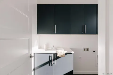 a bathroom with a sink and cabinets