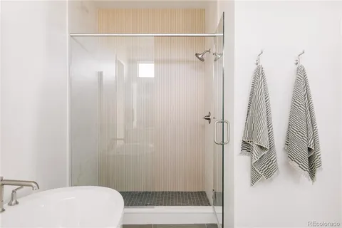 a bathroom with a shower and a toilet