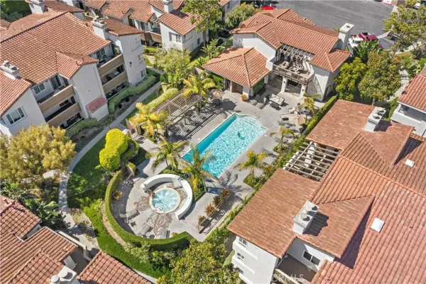 an aerial view of a house with a swimming pool
