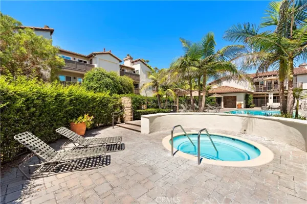 an aerial view of a house with a yard and outdoor seating