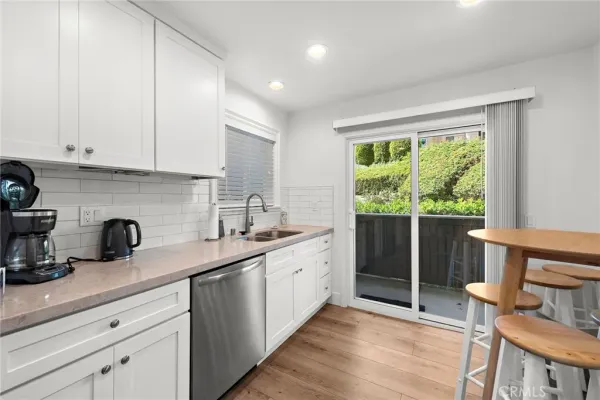 a kitchen with a sink and wooden cabinets