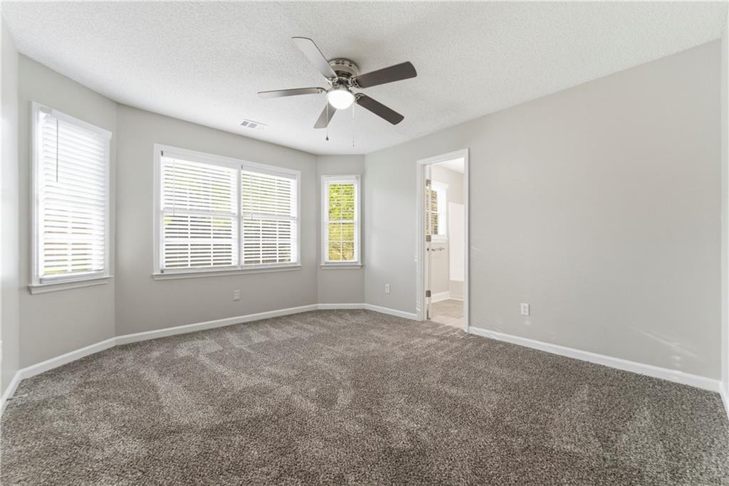 1043 Sterling Ridge Chase Northeast Marietta, GA 30062 - Photo 6 of 14 a view of an empty room with a window