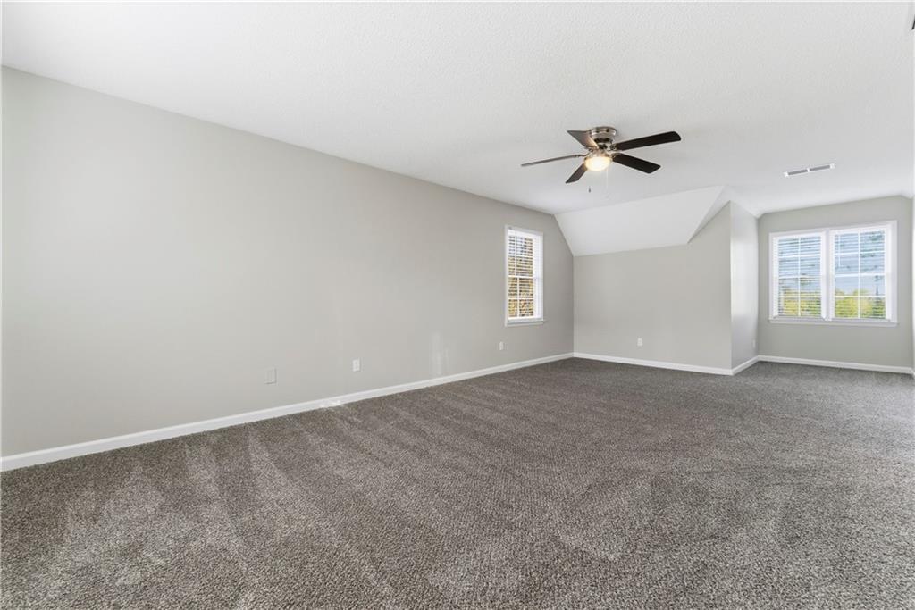 1043 Sterling Ridge Chase Northeast Marietta, GA 30062 - Photo 8 of 14 a view of an empty room with a window