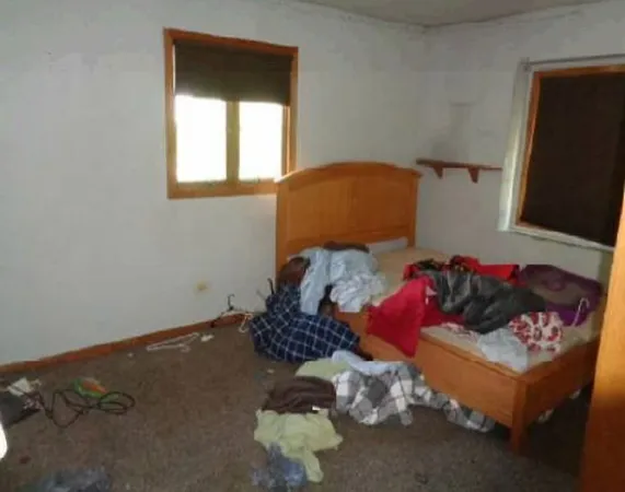 a bed room with a bed and a couch