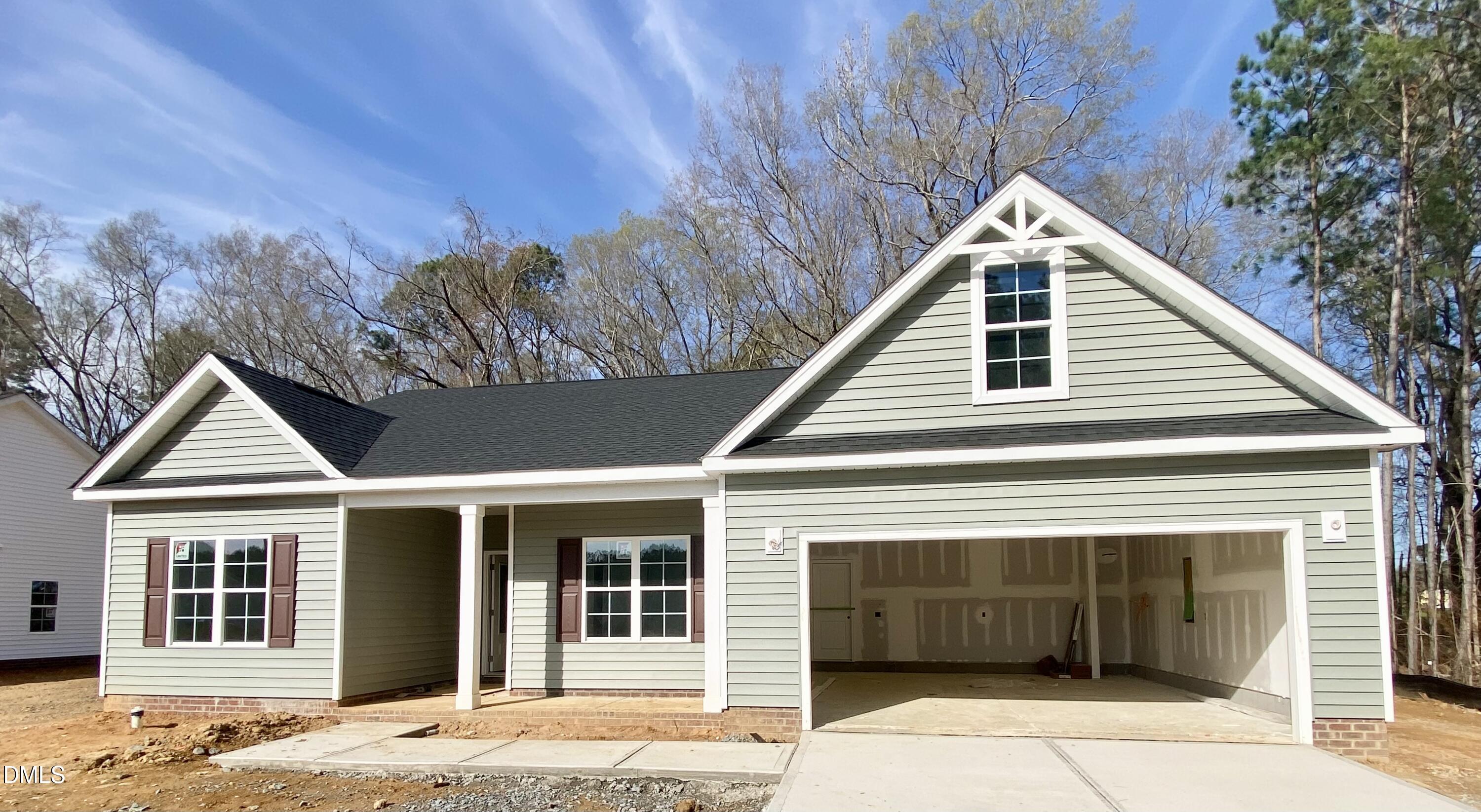 a front view of a house with a garage