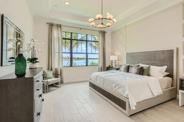 a bedroom with a large bed and a window