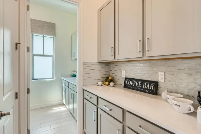 a kitchen with stainless steel appliances a sink stove and cabinets