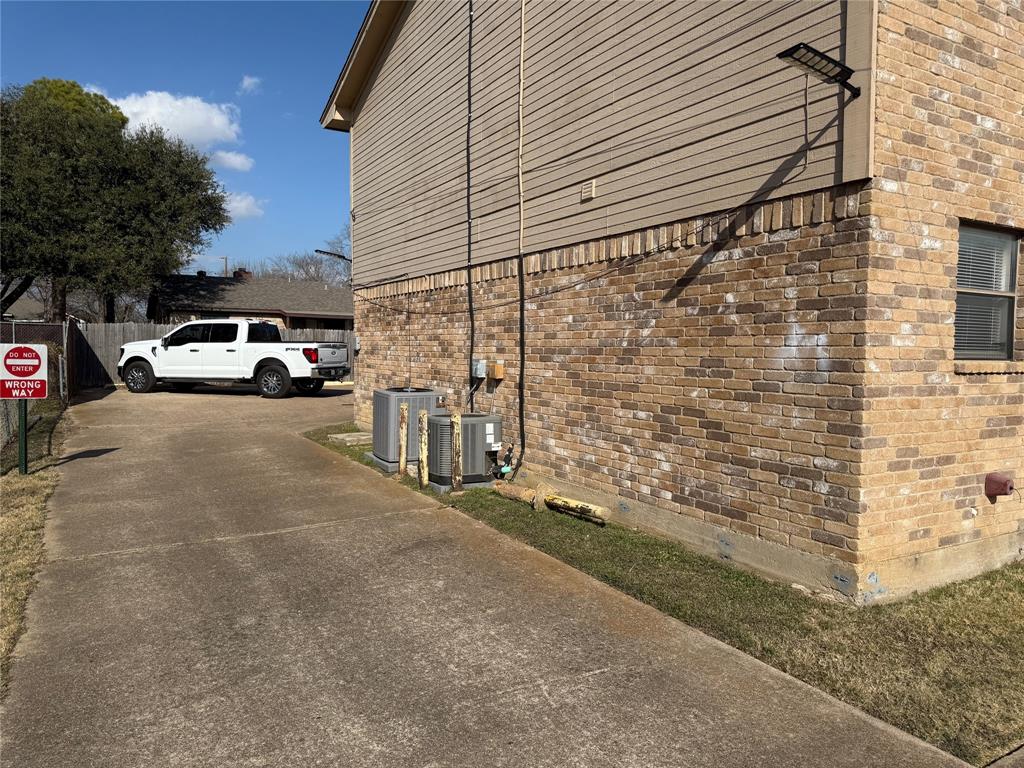 422 West 4th Street Kennedale, TX 76060 - Photo 3 of 25 a view of a street with cars parked on road