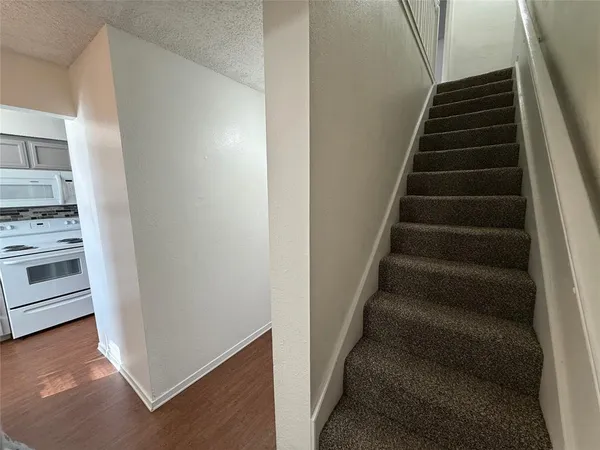 a view of entryway and kitchen