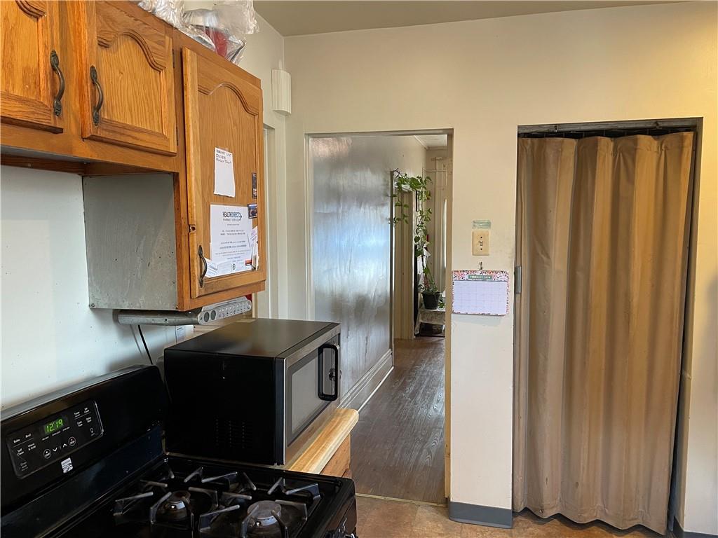 3884 East Street Pittsburgh, PA 15214 - Photo 11 of 49 a kitchen with stainless steel appliances granite countertop a refrigerator and a stove