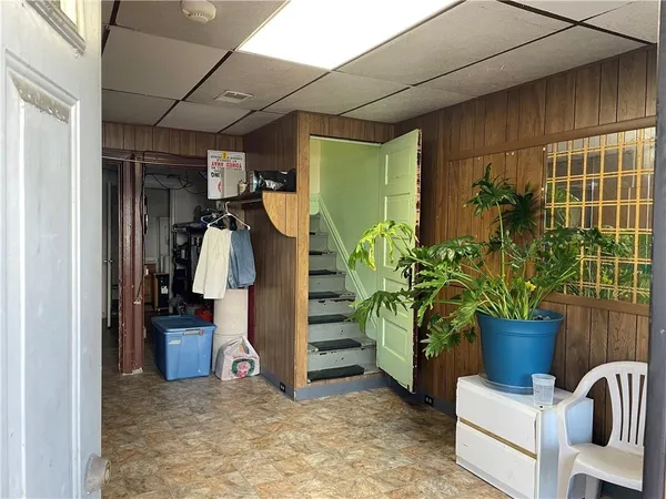 a bathroom with a granite countertop shower and a toilet