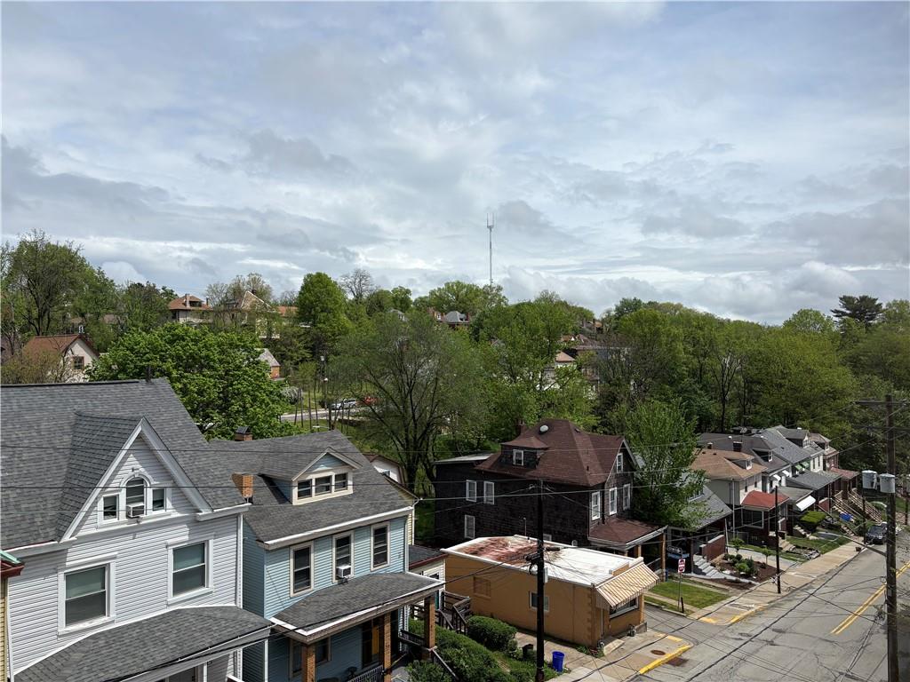 3884 East Street Pittsburgh, PA 15214 - Photo 36 of 49 an aerial view of a house with a big yard and large trees