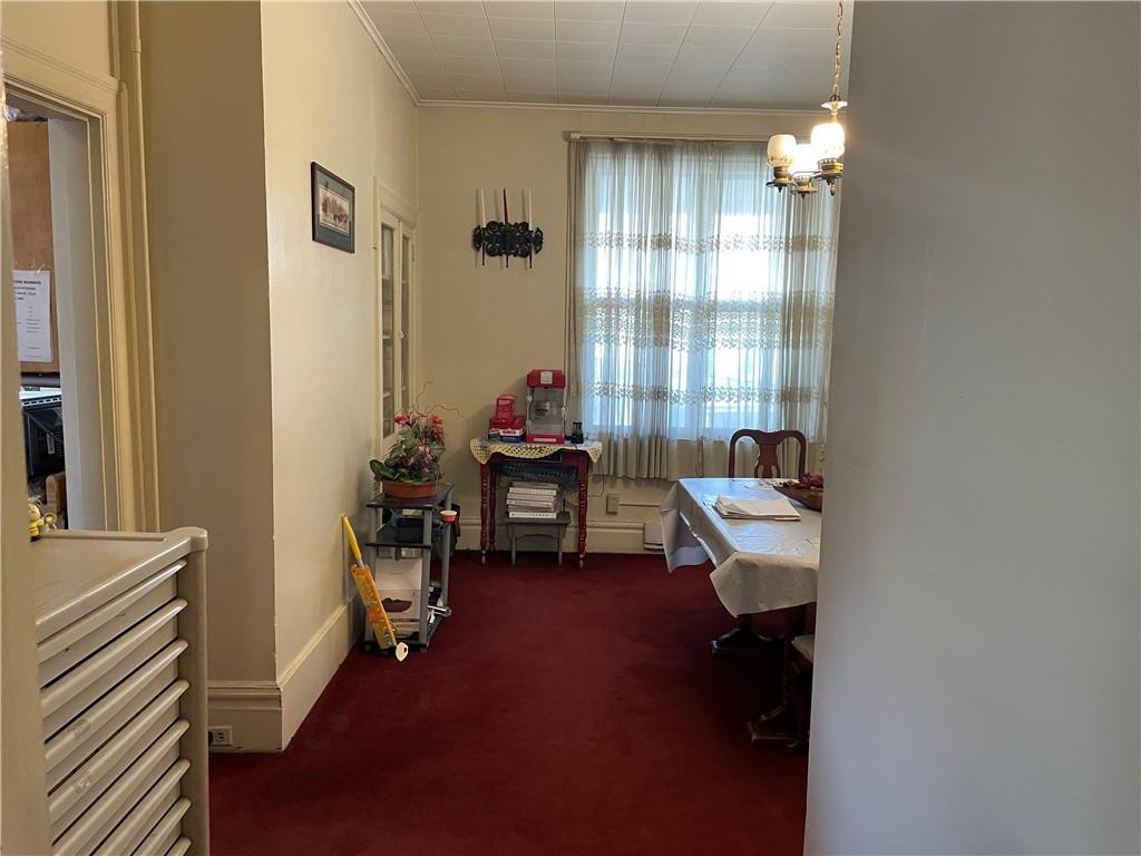 3884 East Street Pittsburgh, PA 15214 - Photo 8 of 49 a living room with furniture and a chandelier