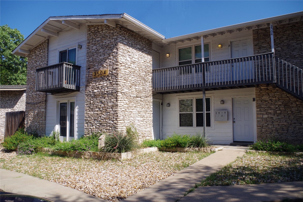 2504 Manor Circle, Unit A Austin, TX 78723 - Photo 1 of 17 a front view of a house with garage
