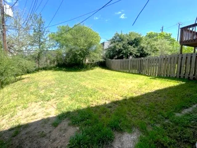 a swimming pool with wooden fence