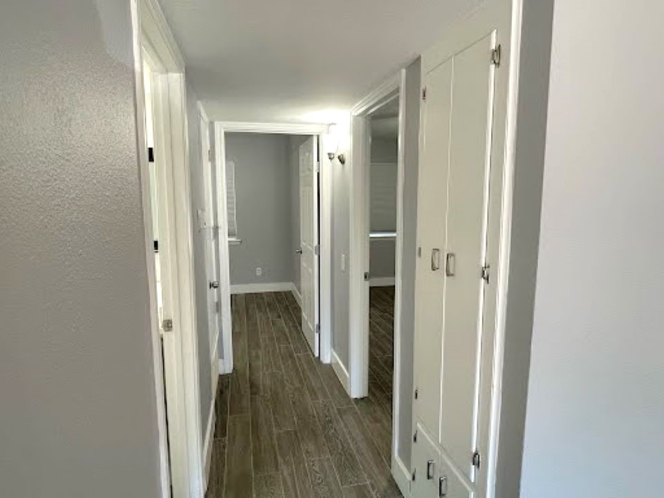 2504 Manor Circle, Unit A Austin, TX 78723 - Photo 7 of 17 a view of a hallway with wooden floor