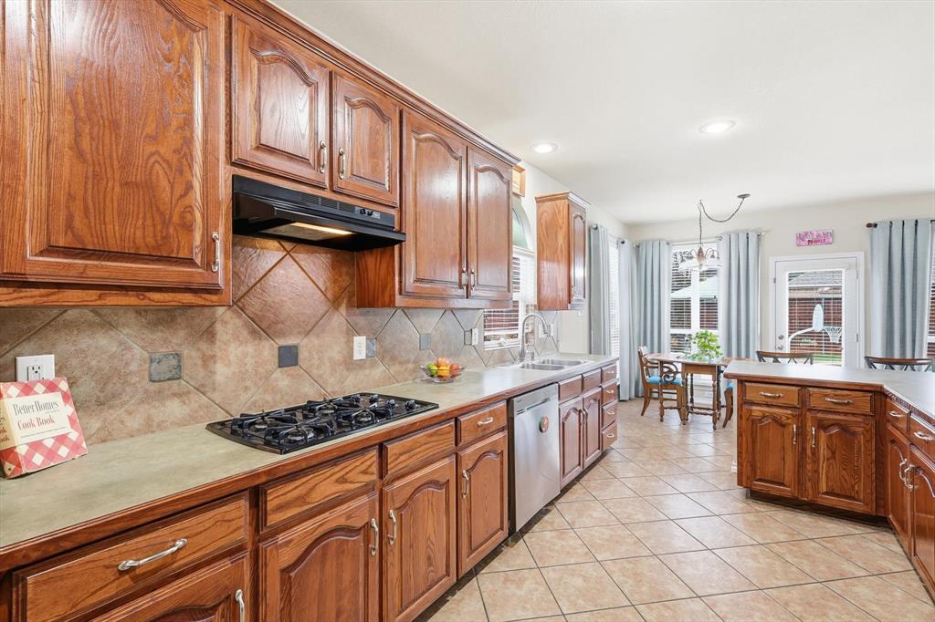 2321 Bear Run Road Arlington, TX 76001 - Photo 11 of 34 a kitchen with lots of counter top space and stove top oven