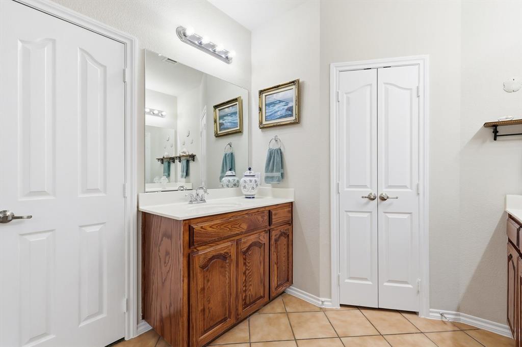 2321 Bear Run Road Arlington, TX 76001 - Photo 19 of 34 a bathroom with a sink vanity and a mirror
