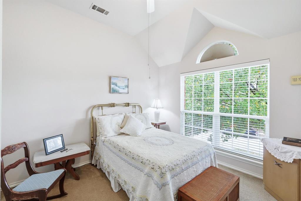 2321 Bear Run Road Arlington, TX 76001 - Photo 23 of 34 a bedroom with a bed a couch and a window