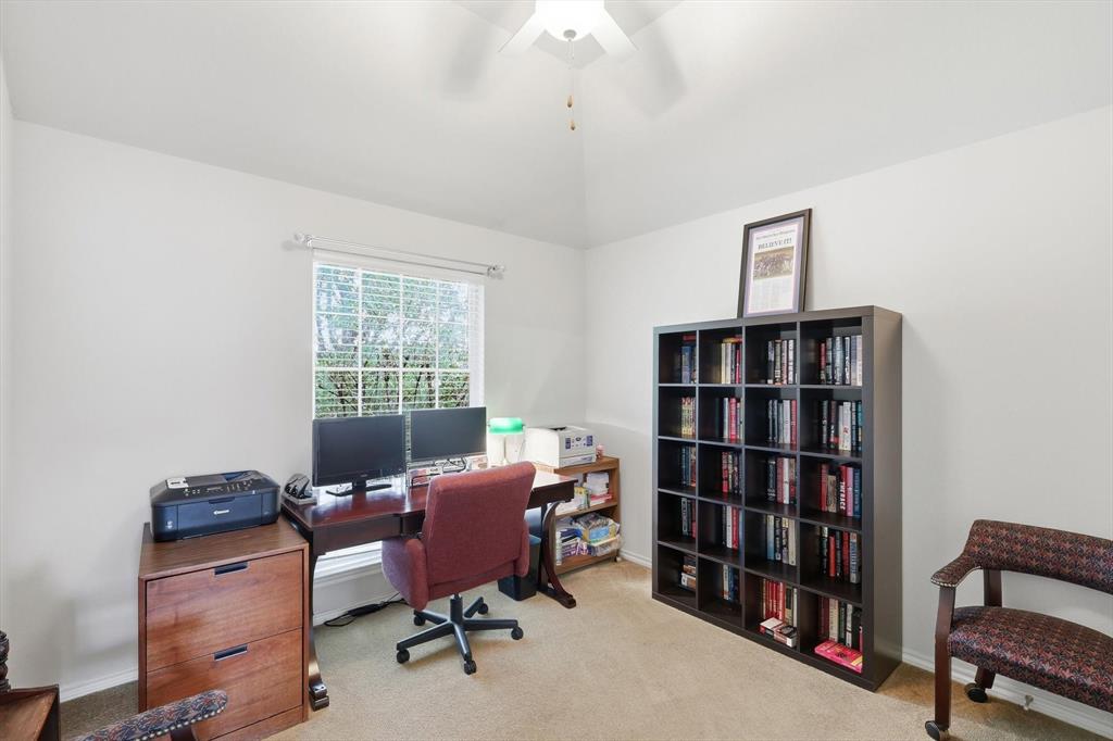 2321 Bear Run Road Arlington, TX 76001 - Photo 24 of 34 a view of a workspace with furniture and a bookshelf
