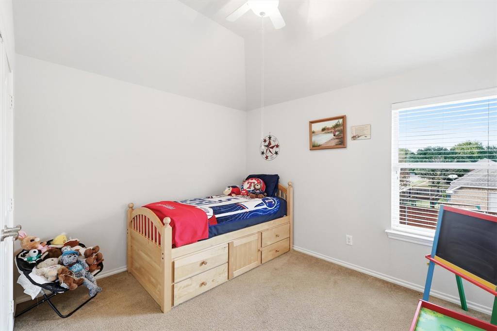 2321 Bear Run Road Arlington, TX 76001 - Photo 25 of 34 a bedroom with a bed and a window