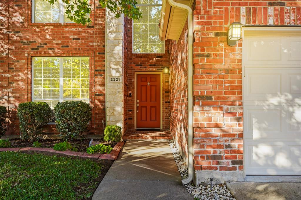 2321 Bear Run Road Arlington, TX 76001 - Photo 3 of 34 a view of a brick house with a large windows