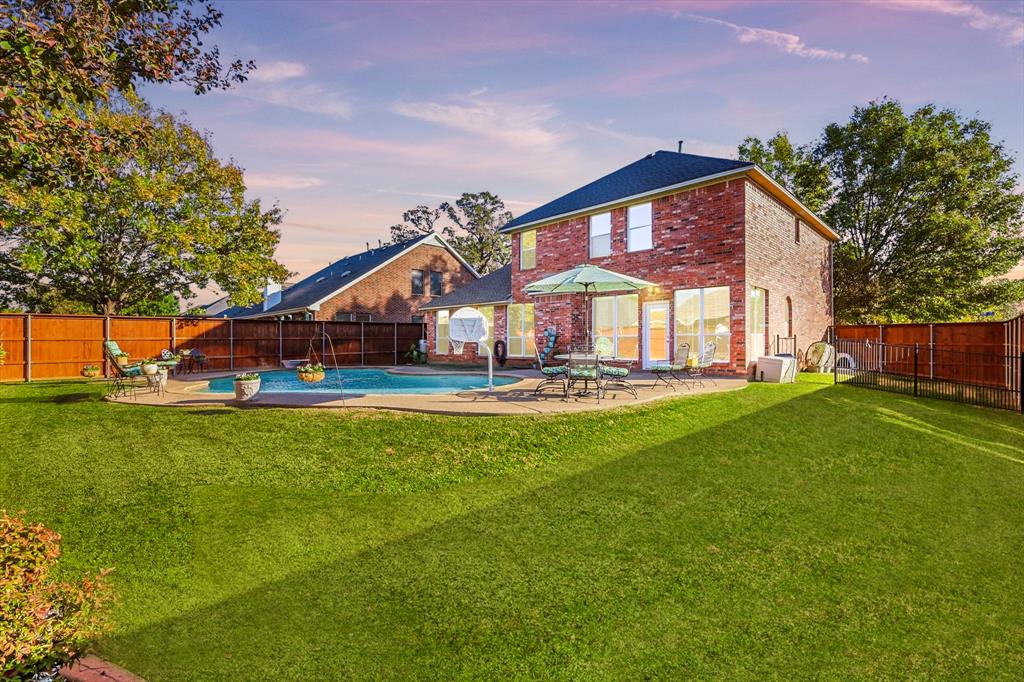2321 Bear Run Road Arlington, TX 76001 - Photo 31 of 34 a front view of house with yard and outdoor seating