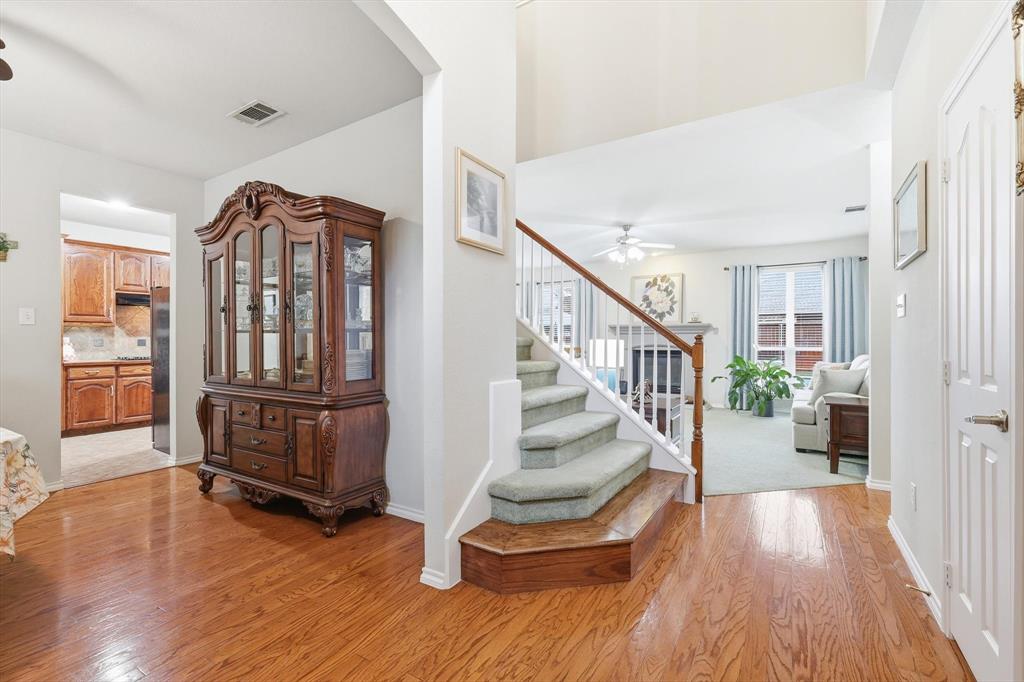 2321 Bear Run Road Arlington, TX 76001 - Photo 4 of 34 a view of entryway with wooden floor and stairs