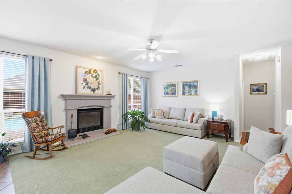 2321 Bear Run Road Arlington, TX 76001 - Photo 6 of 34 a living room with furniture and a fireplace