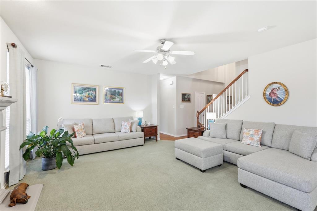 2321 Bear Run Road Arlington, TX 76001 - Photo 7 of 34 a living room with furniture and a chandelier