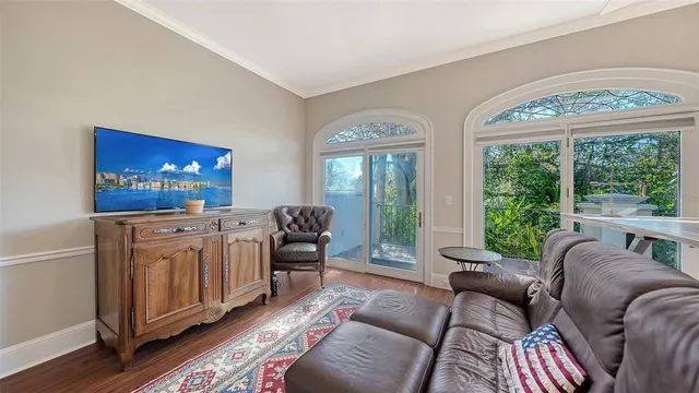 a bedroom with a bed and a lamp on dresser