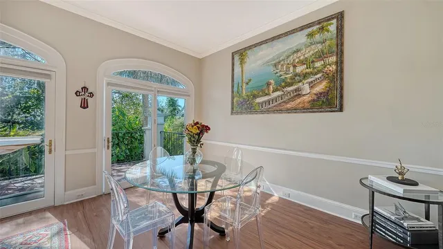 a bedroom with bed and a chandelier
