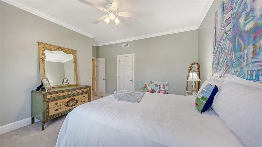 57 Bishopscourt Road, Unit 121 Osprey, FL 34229 - Photo 30 of 86 a bedroom with a bed and a chandelier