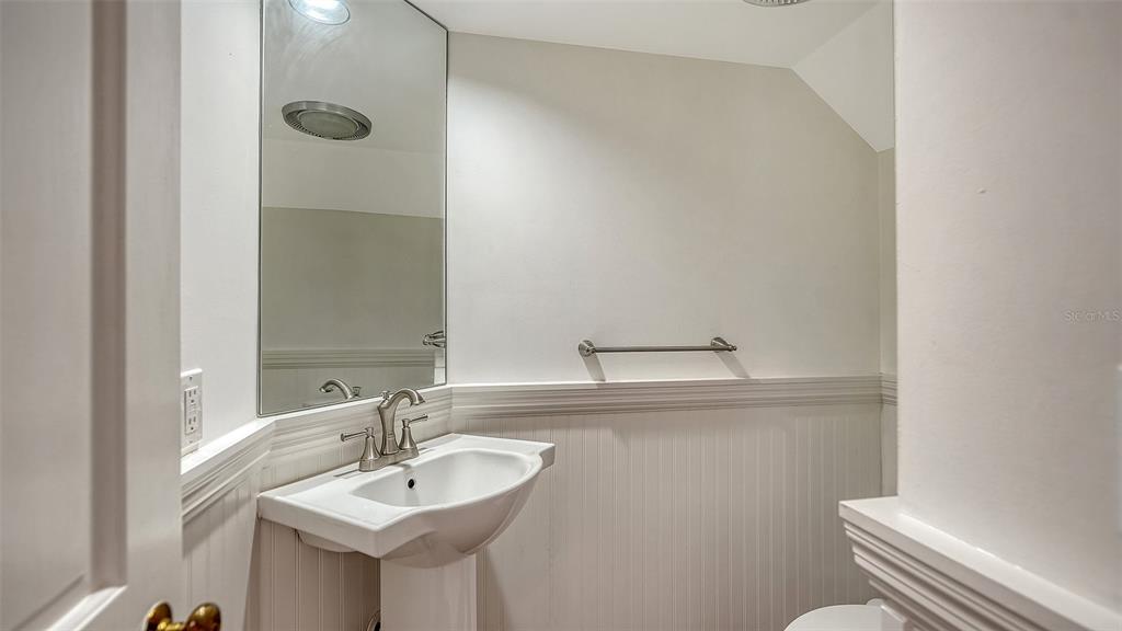 57 Bishopscourt Road, Unit 121 Osprey, FL 34229 - Photo 40 of 86 a bathroom with a sink and a toilet