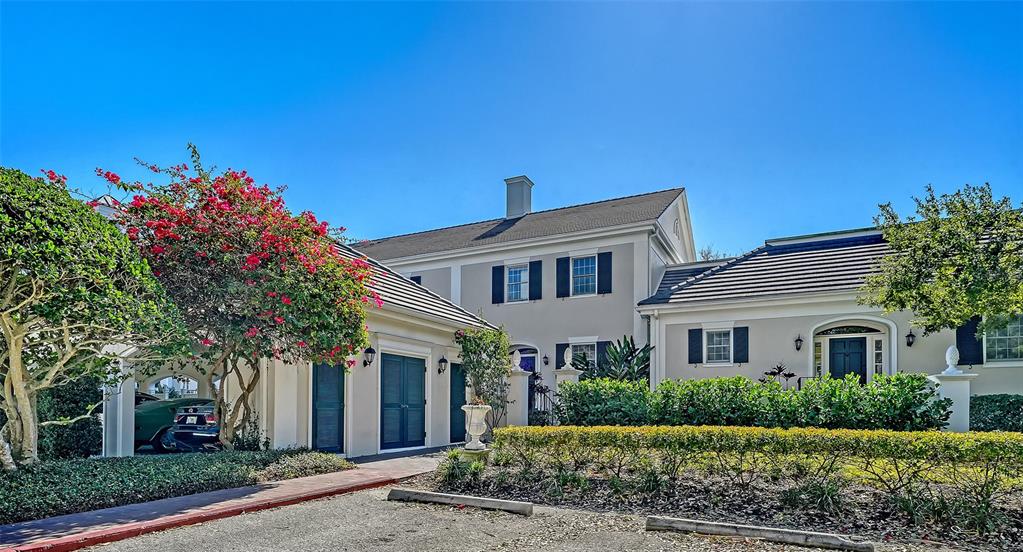 57 Bishopscourt Road, Unit 121 Osprey, FL 34229 - Photo 4 of 86 a front view of a house with a yard