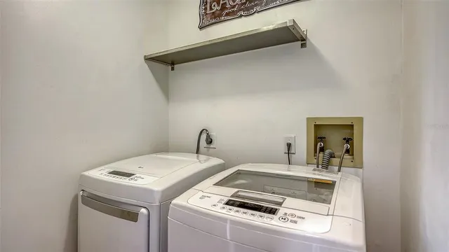 a view of entryway with a chandelier and rug