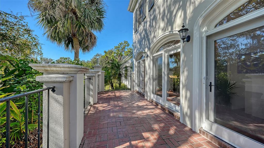 57 Bishopscourt Road, Unit 121 Osprey, FL 34229 - Photo 44 of 86 a view of a back yard from a corridor