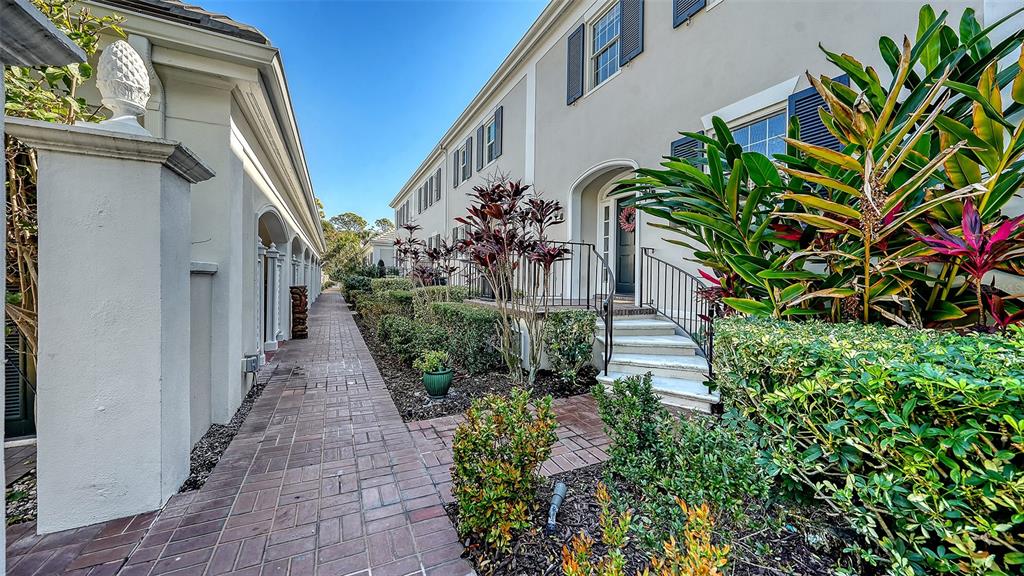 57 Bishopscourt Road, Unit 121 Osprey, FL 34229 - Photo 46 of 86 a view of a pathway in outside of the house